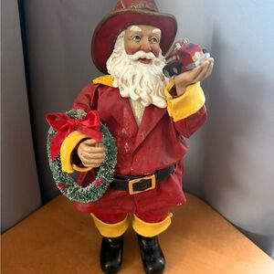Possible Dreams Festive Santa Figurine with Wreath and Toy Car